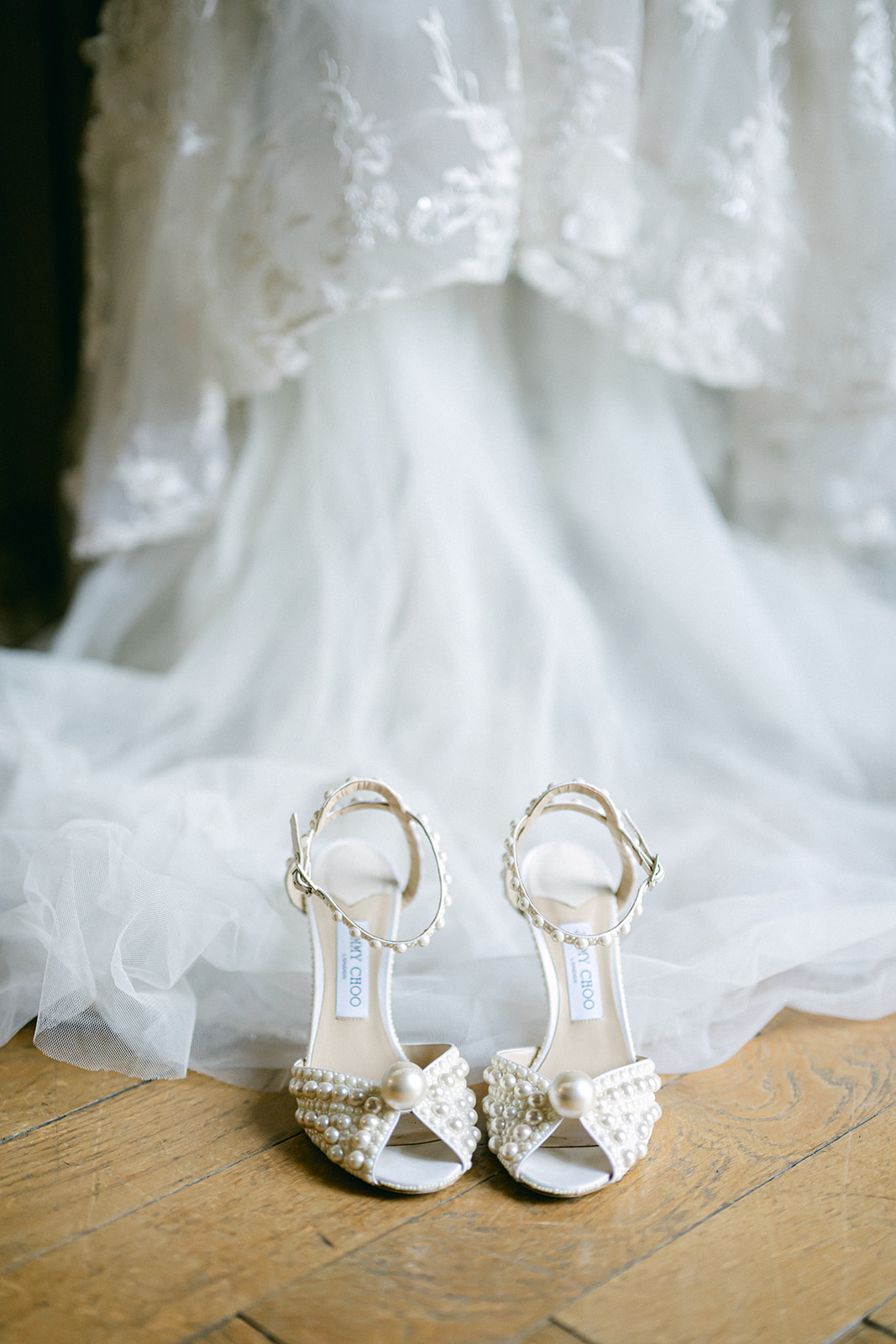 Crystal bridal heels placed beneath Fran's lace wedding dress.