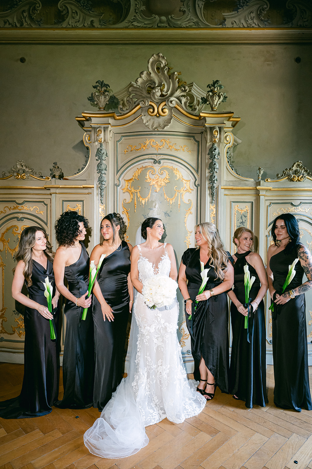 Fran surrounded by her bridesmaids in green dresses inside Villa Erba.