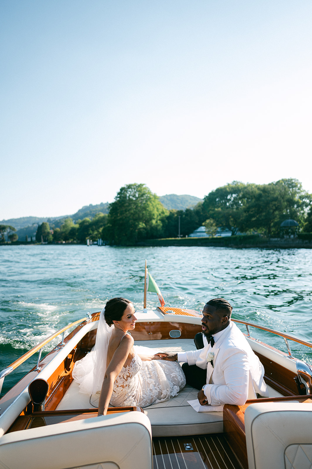 Fran and Ope enjoying a private boat ride on Lake Como after their wedding ceremony.