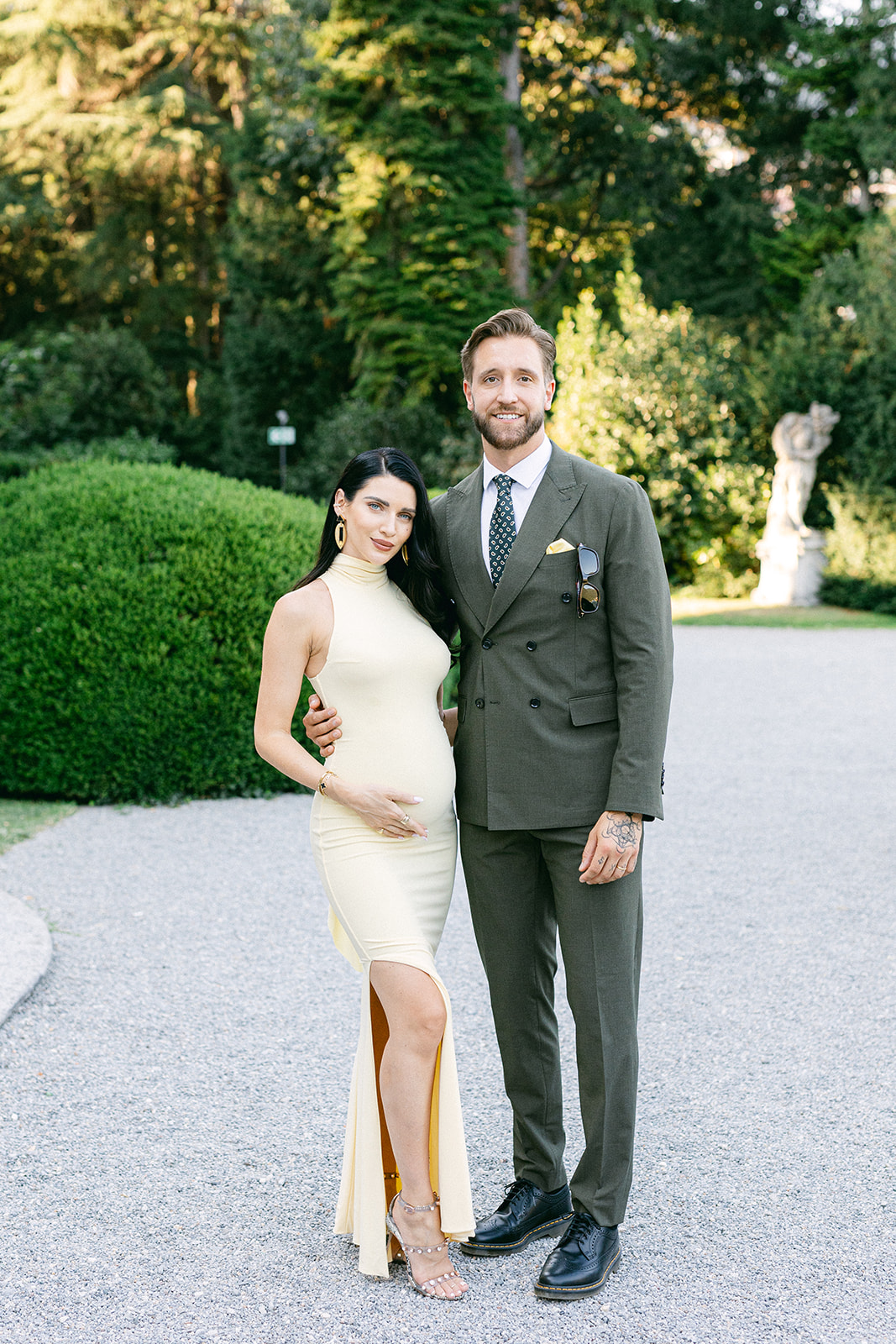 Wedding guests posing together in the gardens of Villa Erba.