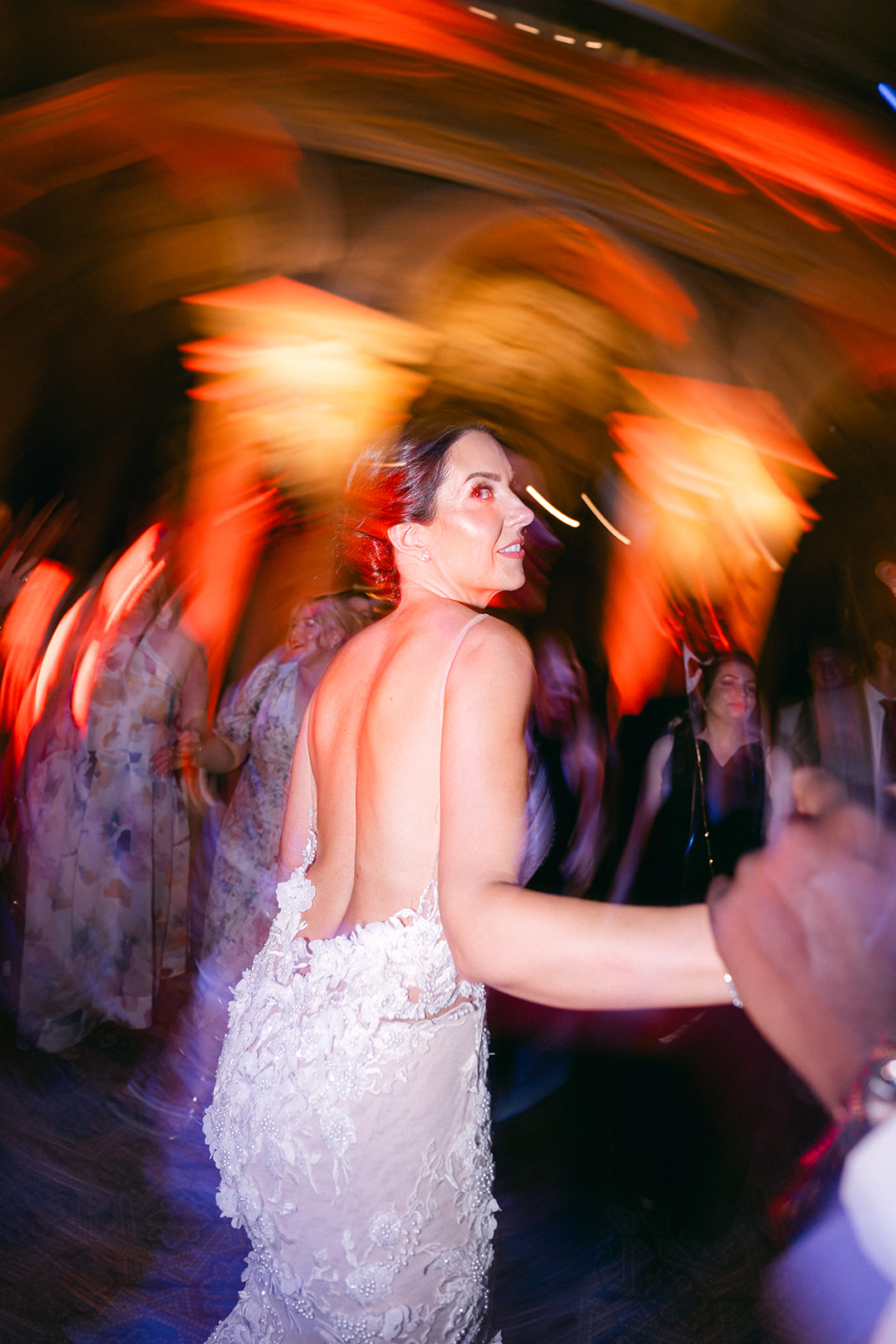 Fran looking back while dancing during the wedding party at Villa Erba.